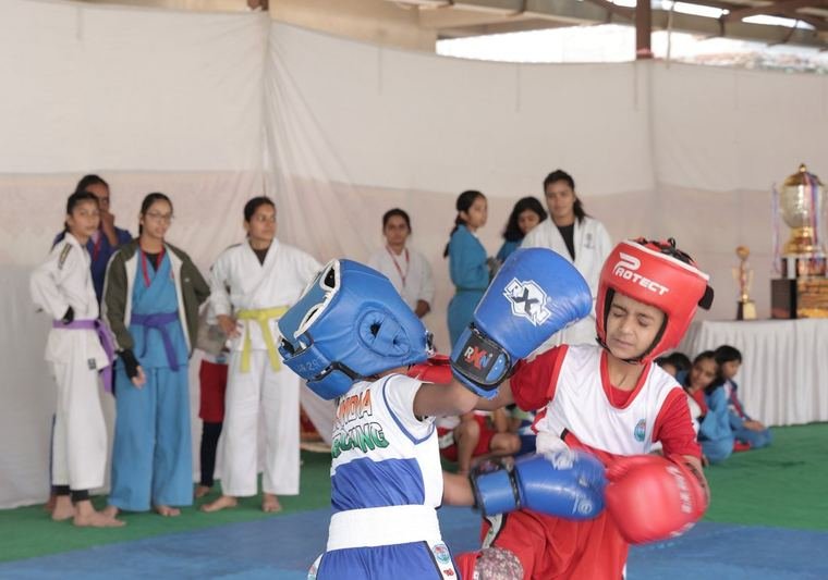 Kids sparring at an ASMITA Kickboxing League event